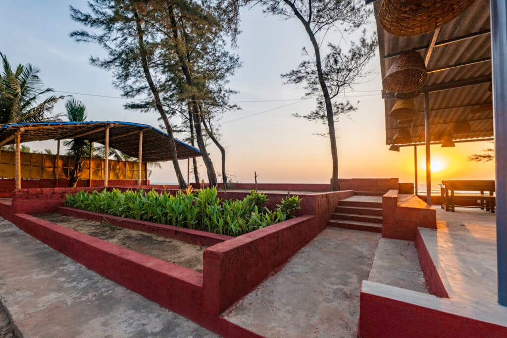 Outdoor seating looking toward the beach at Famstel Gokarna