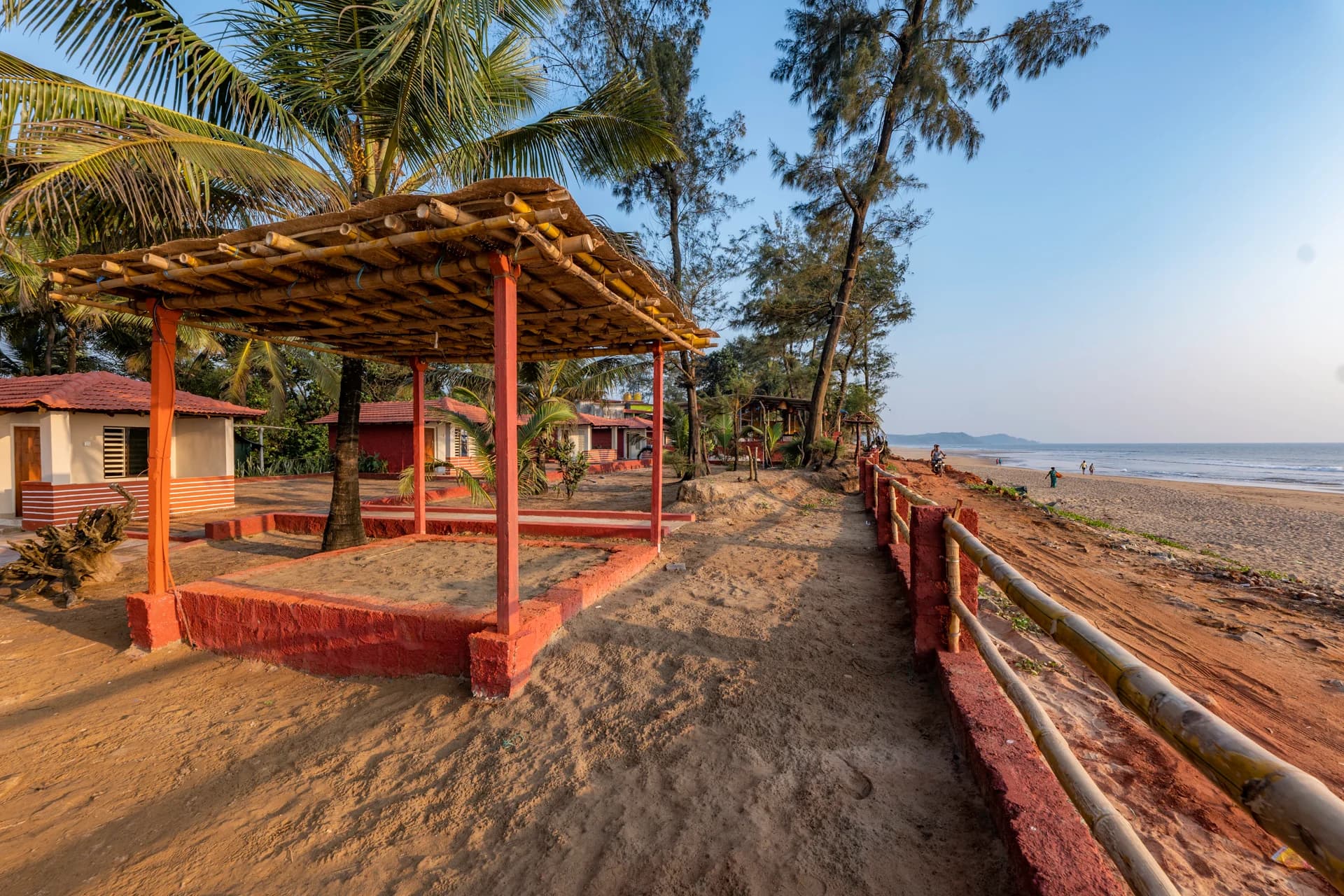 Open-air seating beside the beach at Famstel Gokarna