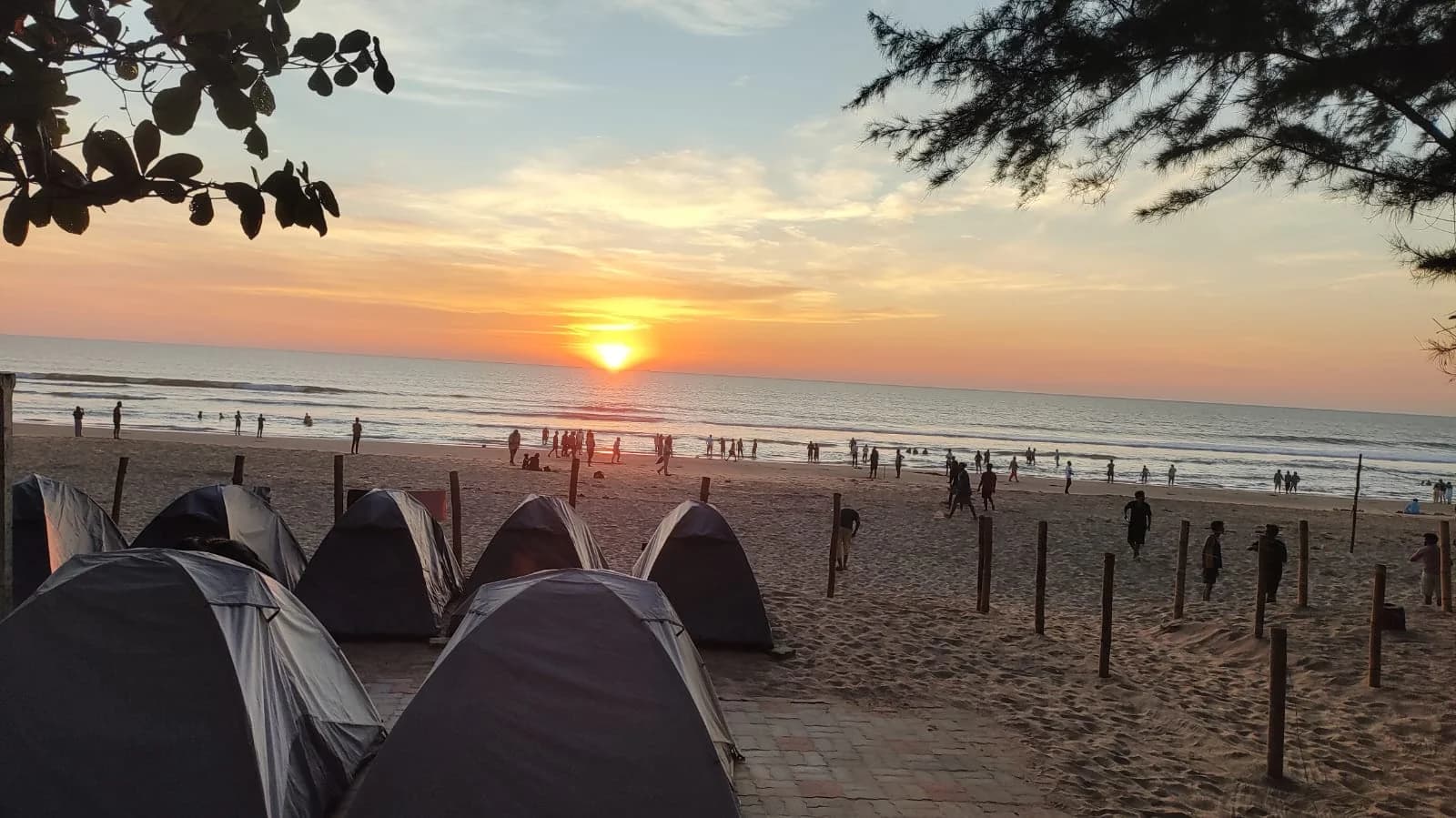 Tents overlooking the sea at sunset at Trippr Gokarna
